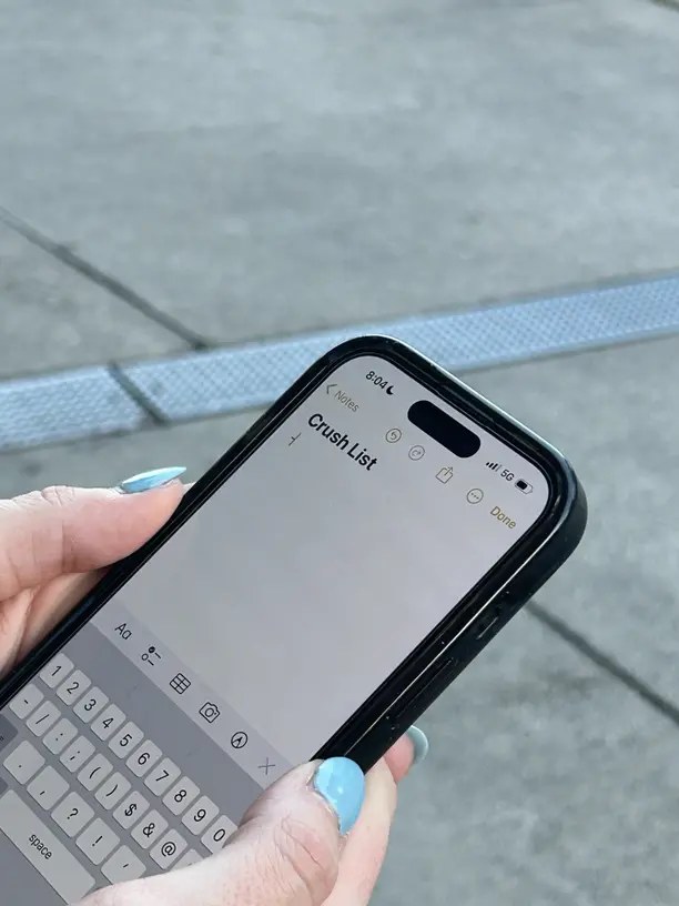 Homeowner checking contractor social media on a phone before hiring